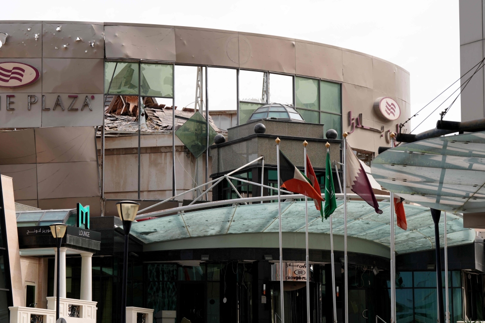 The damaged Crown Plaza hotel, following an Iranian military strike, in Manama on March 1, 2026. (Photo by Fadhel Madan / AFP)