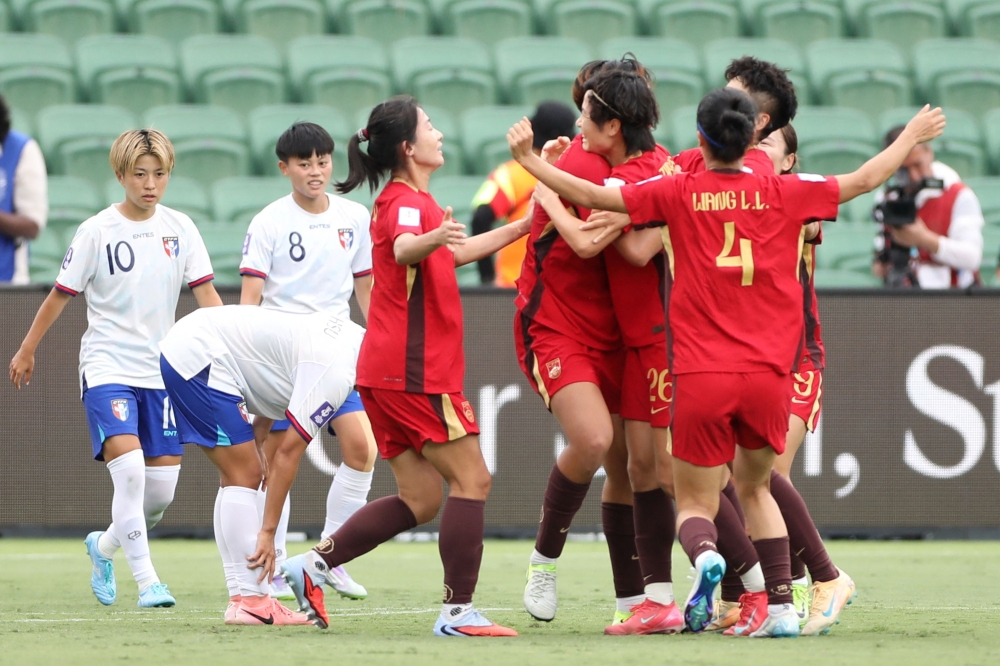 China players (R) celebrate a goal by teammate Shao Ziqin during the AFC Women's Asian Cup Australia 2026 football match between China and Taiwan in Perth. (Photo by Antony Dickson/ AFP) 