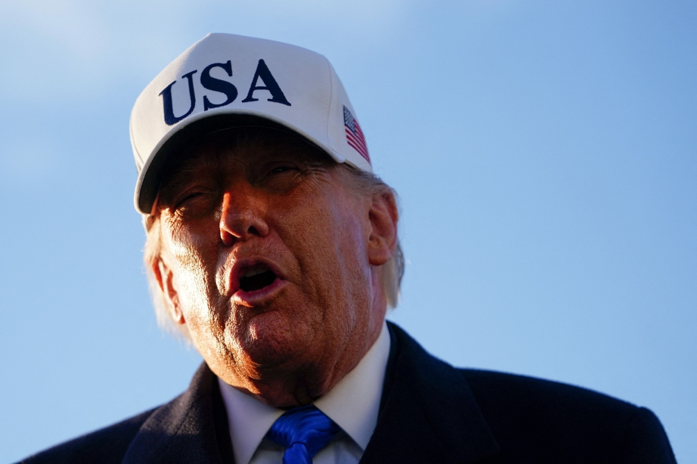 US President Donald Trump speaks to the media before boarding Air Force One on March 13, 2026 at Joint Base Andrews, Maryland. Nathan Howard/Getty Images/AFP 
