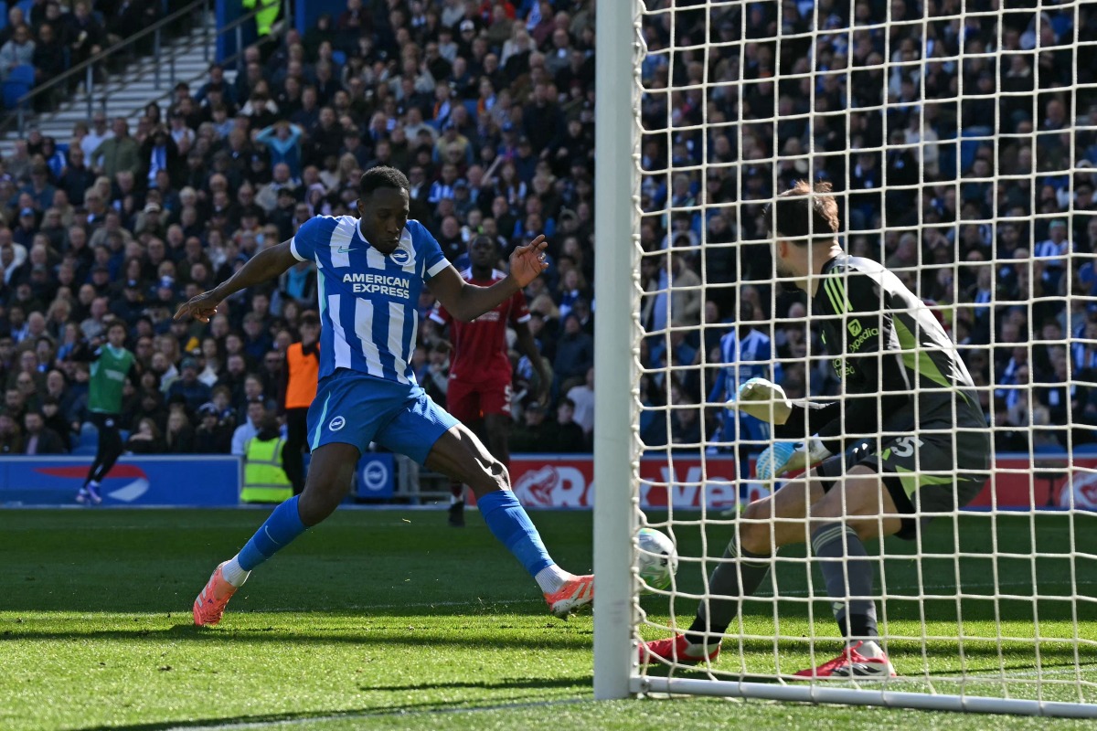 Brighton's English striker #18 Danny Welbeck scores their second goal during the English Premier League football match between Brighton and Hove Albion and Liverpool at the American Express Community Stadium in Brighton, southern England on March 21, 2026. (Photo by Glyn KIRK / AFP) 