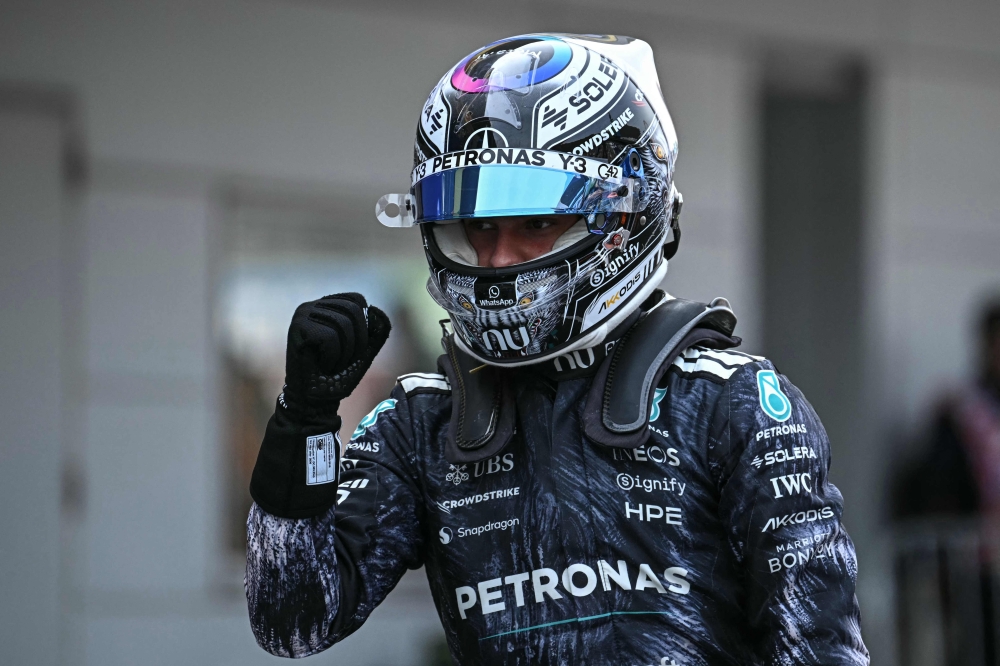 Mercedes' Italian driver Kimi Antonelli reacts after the qualifying session ahead of the Formula One Japanese Grand Prix at the Suzuka circuit in Suzuka, Mie prefecture on March 28, 2026. (Photo by Philip Fong / AFP)