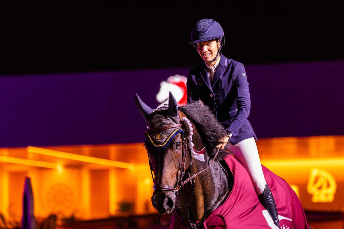 Cyrine Cherif celebrates astride Triple T Calamando Blue.