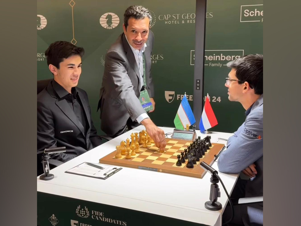 President of the Qatar Chess Federation Mohammed Al-Mudahka makes the ceremonial first move during the match at the Candidates Championship in Cyprus.
