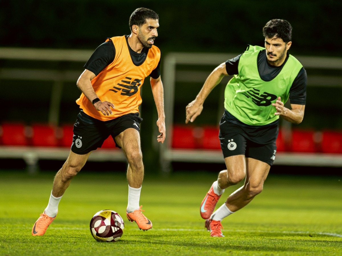 Al Sadd's Hassan Al Haydos (left) and Ahmed Suhail during a training session yesterday.
