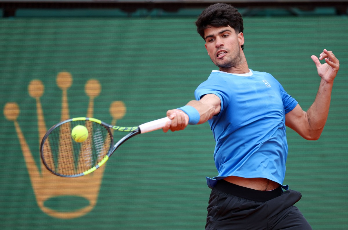 Spain’s Carlos Alcaraz plays a forehand return to Argentina’s Sebastian Baez.