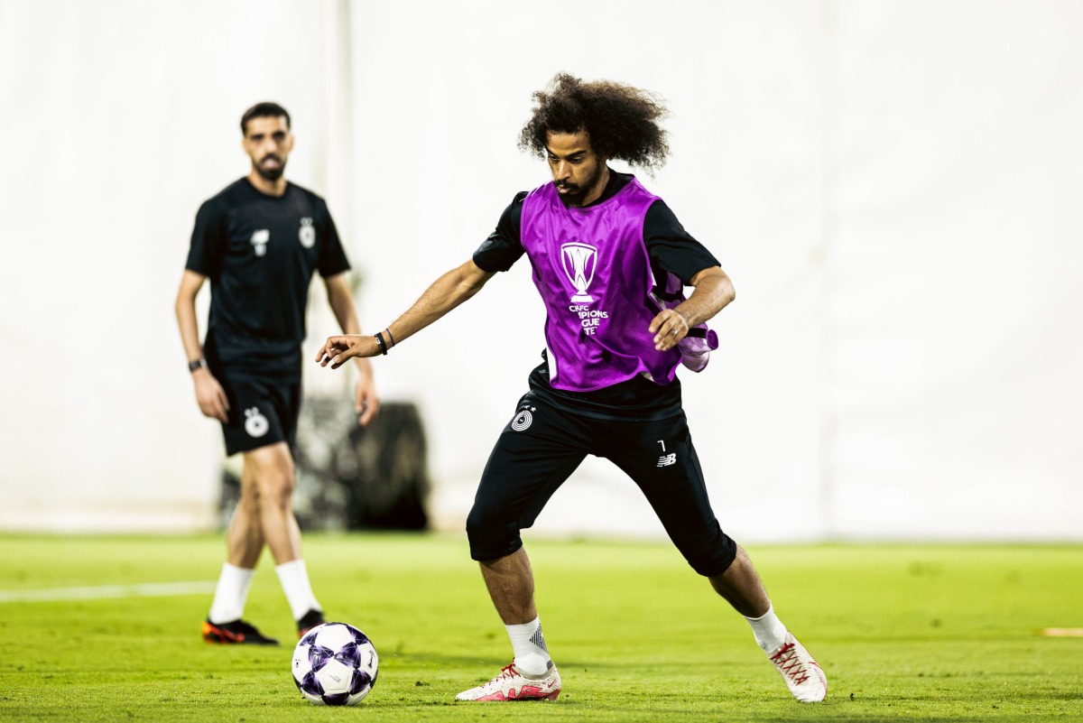 Al Sadd's Akram Afif and Hassan Al Haydos (left) train ahead of the match against Al Hilal SFC.
