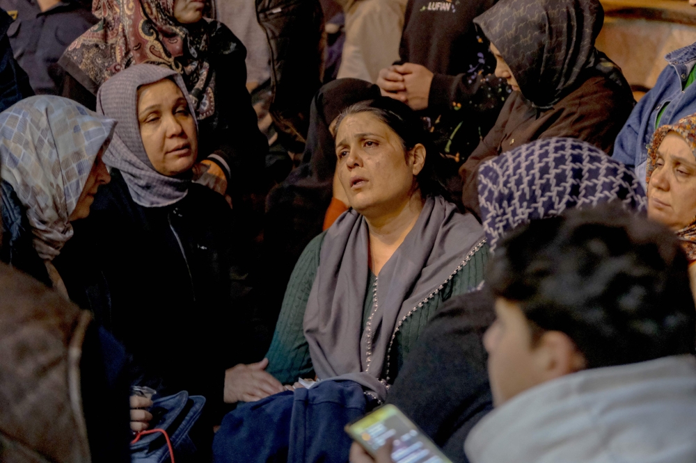 Families of victims wait in front of a hospital in Kahramanmaras, on April 15, 2026, after a teenager opened fire in a school in the city.  (Photo by Orhan Erkilic / AFP)