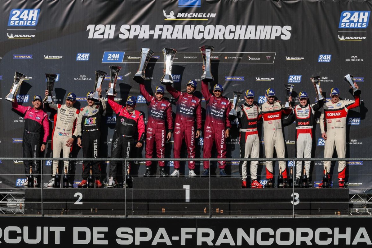 Team Qatar drivers Abdullah Al-Khelaifi, Ahmed Al-Emadi and Faisal Al-Yafei (centre) celebrate on the podium. 