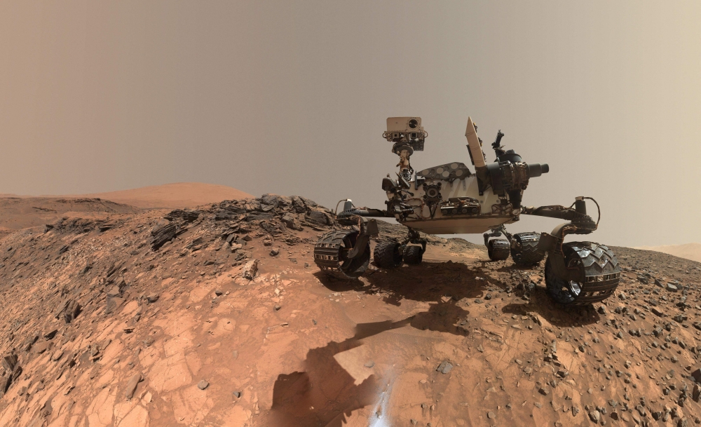 (Files) This NASA photo released June 7, 2018, shows a low-angle self-portrait of NASA's Curiosity Mars rover vehicle at the site from which it reached down to drill into a rock target called 