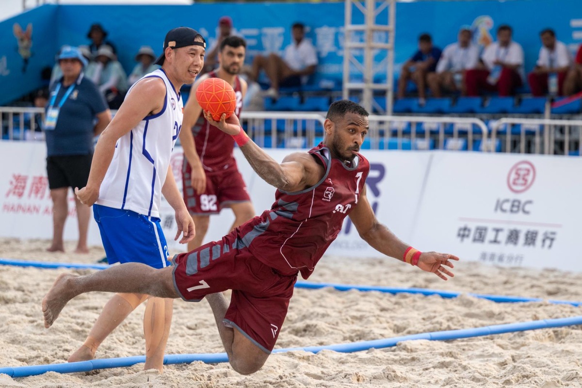 A Qatar player shoots to score during match against Mongolia.