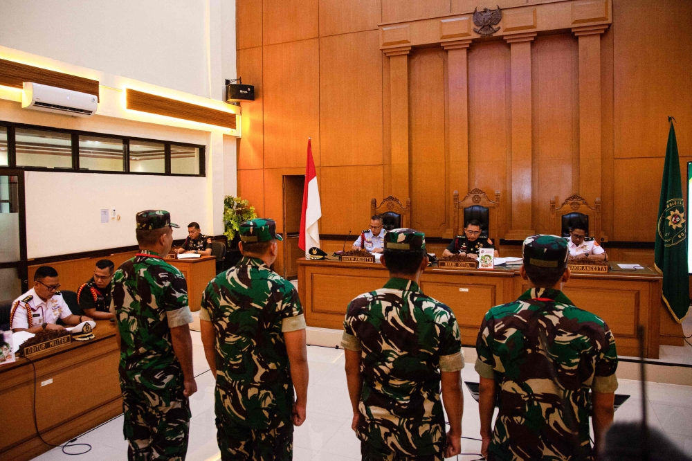 INDONESIA-RIGHTS-CRIME-COURT
Military personnel accused of throwing acid at human rights activist Andri Yunus attend a trial at a military court in Jakarta on April 29, 2026. 

 (Photo by Aditya Irawan / AFP)
