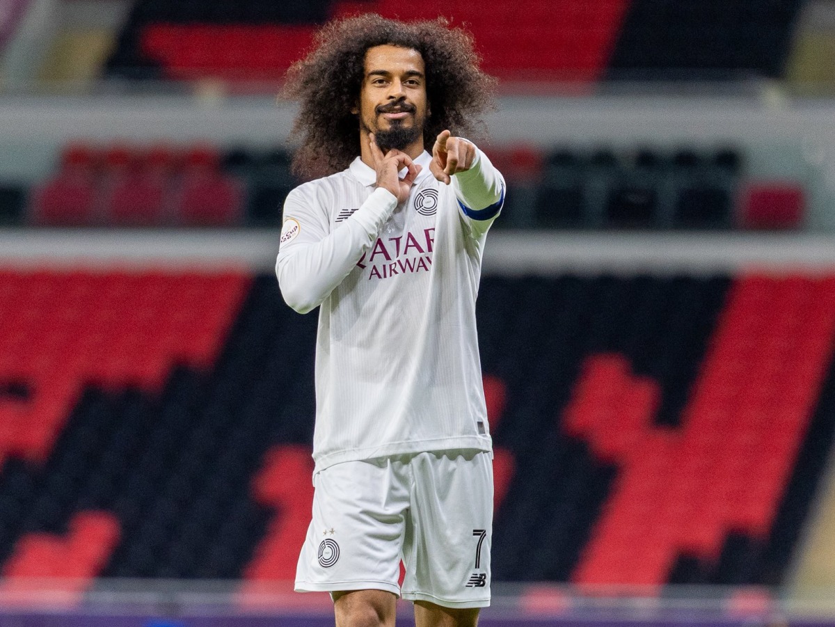 Akram Afif celebrates after scoring.
