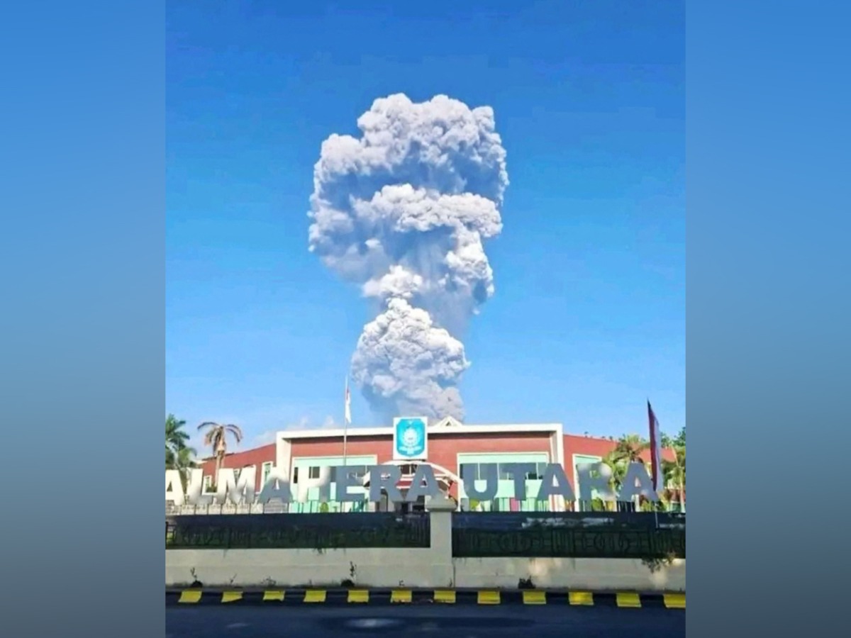 A handout picture taken and released by Indonesia's disaster mitigation agency (BNPB) on May 8, 2026, shows smoke rising from the eruption of Mount Dukono as seen from Tobelo, North Maluku. AFP PHOTO / Indonesia DISASTER MITIGATION AGENCY
