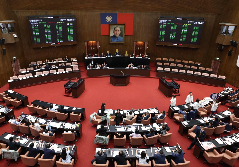 Taiwan's parliament members approve a 25 billion USD defence spending bill at Legislative Yuan chamber in Taipei on May 8, 2026. (Photo by I-Hwa Cheng / AFP)