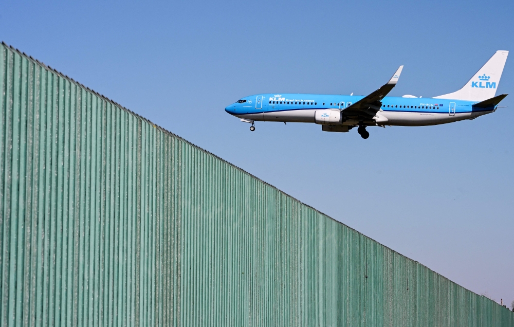 (Files) A KLM Royal Dutch Airlines plane lands at Milan Linate airport northern Italy, on April 7, 2026. (Photo by Stefano Rellandini / AFP)