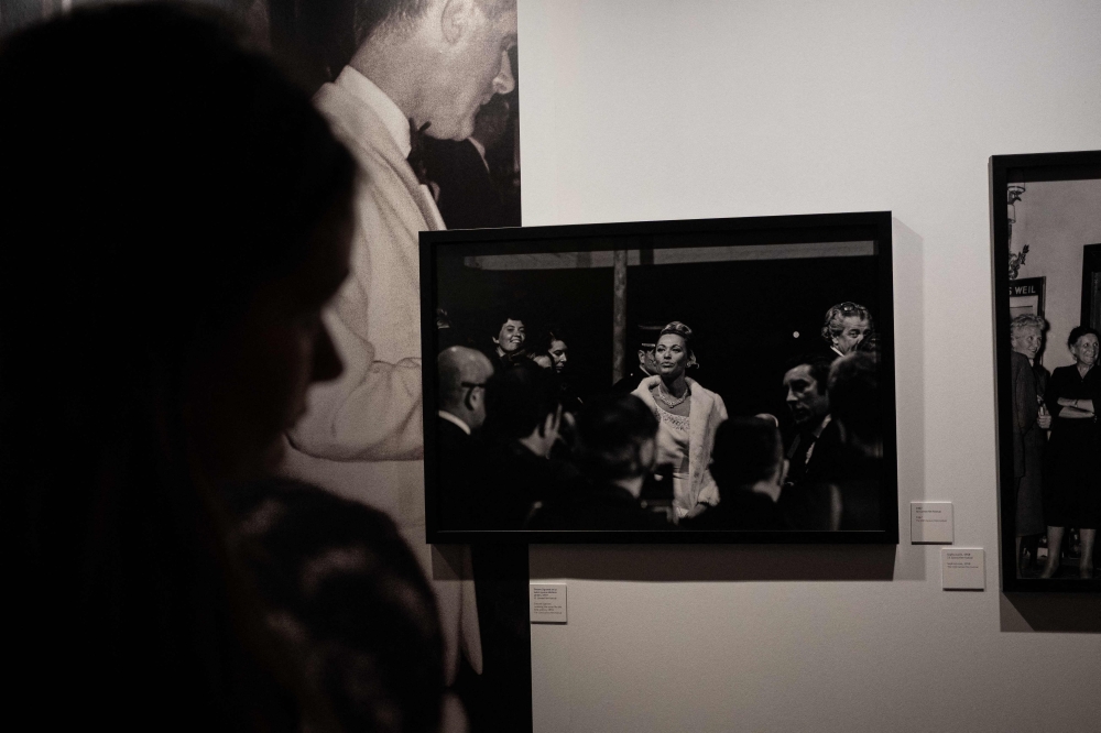 A woman looks at a picture taken by Turkish photojournalist Ara Guler during the Cannes Film Festival at the Ara Guler Museum in Istanbul, on May 7, 2026. (Photo by Ozan Kose / AFP)