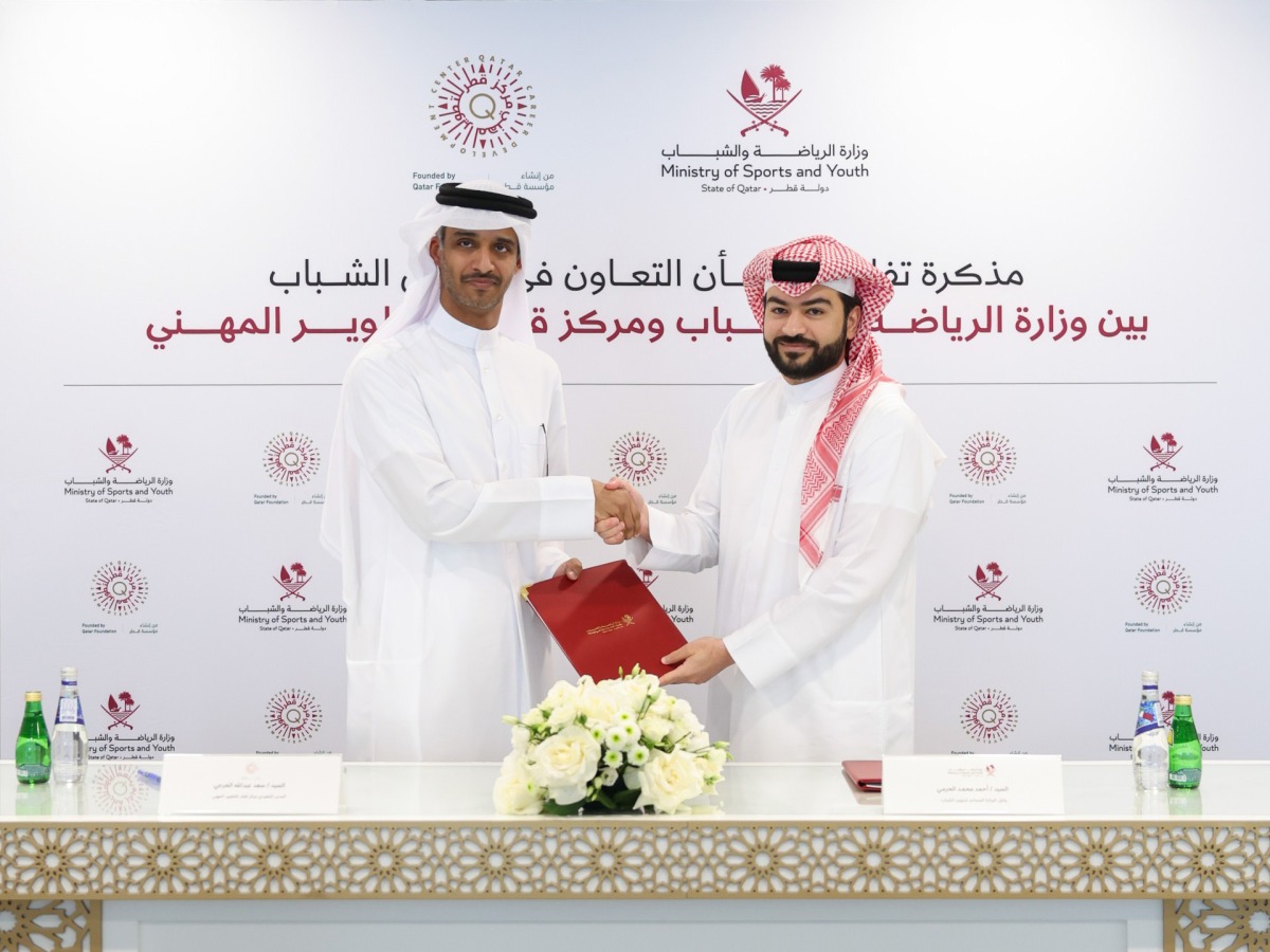Assistant Undersecretary for Youth Affairs at the Ministry of Sports and Youth, Ahmed Mohammed Al-Harami and Executive Director of QCDC, Saad Abdulla Al-Kharji (left) at the MoU signing.