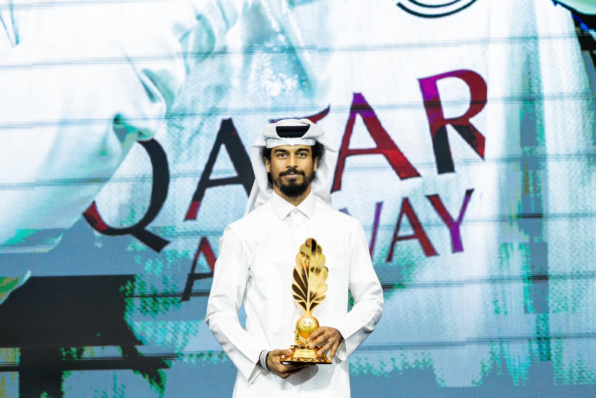 Al Sadd's Akram Afif with the Best Player Award.