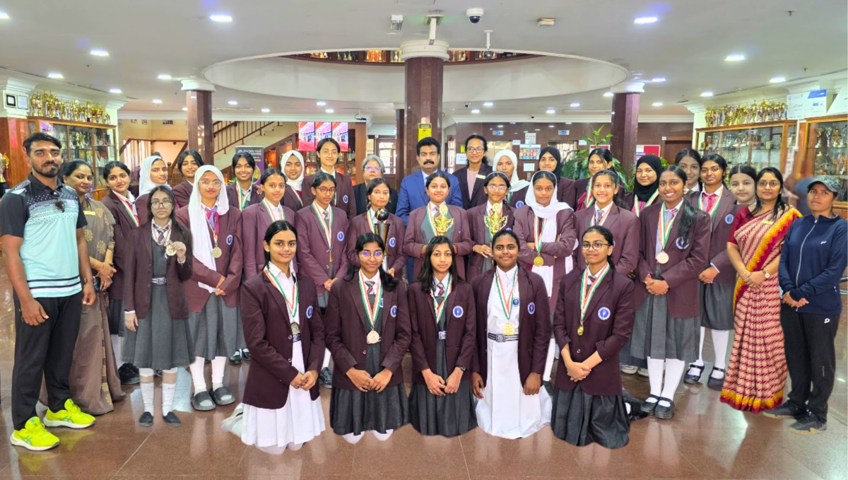 BPS Principal Dr. Anand R Nair, staffs with the school’s girls handball teams.
