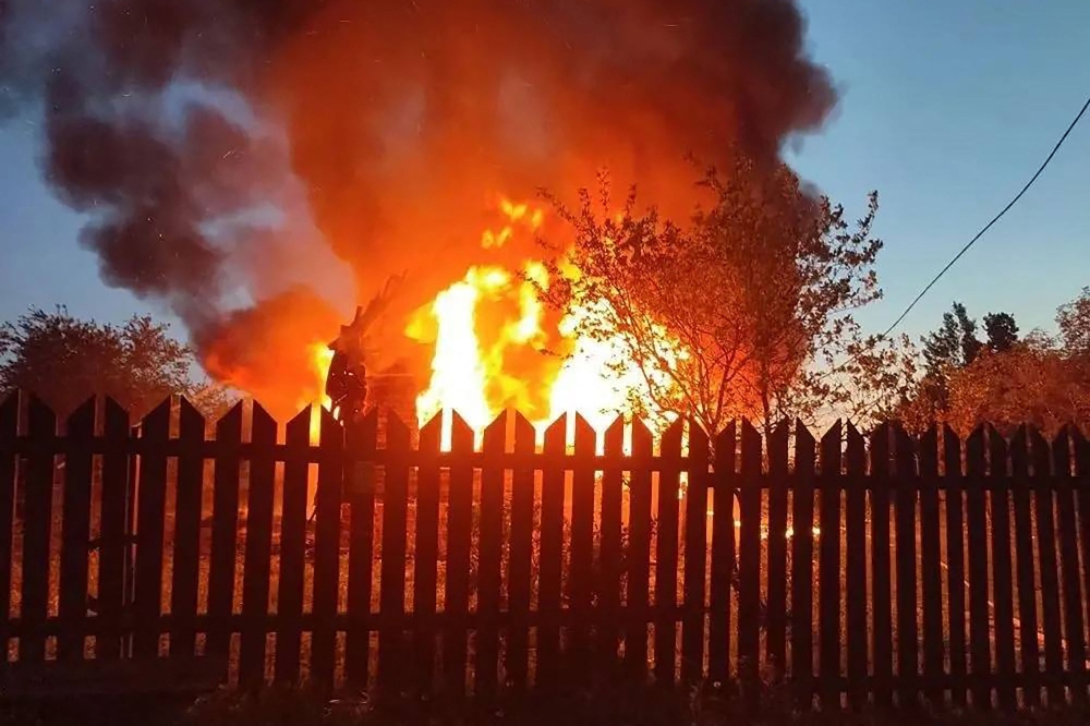 This handout photograph posted on the official Telegram channel of Moscow Region Governor Andrey Vorobyov on May 17, 2026 shows a burning building following an air attack at an undisclosed location in the Moscow region, amid the ongoing Russian-Ukrainian conflict. (Photo by Handout / Telegram / @vorobiev_live / AFP)