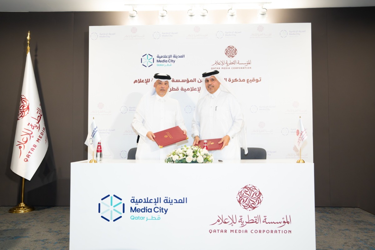 Director of the International Cooperation and Agreements at Qatar Media Corporation Abdulla Ghanim Almuhannadi and CEO of Media City Qatar Hamad Omar A. Al-Mannai exchanging document after signing an agreement in a ceremony held yesterday at QMC premises.