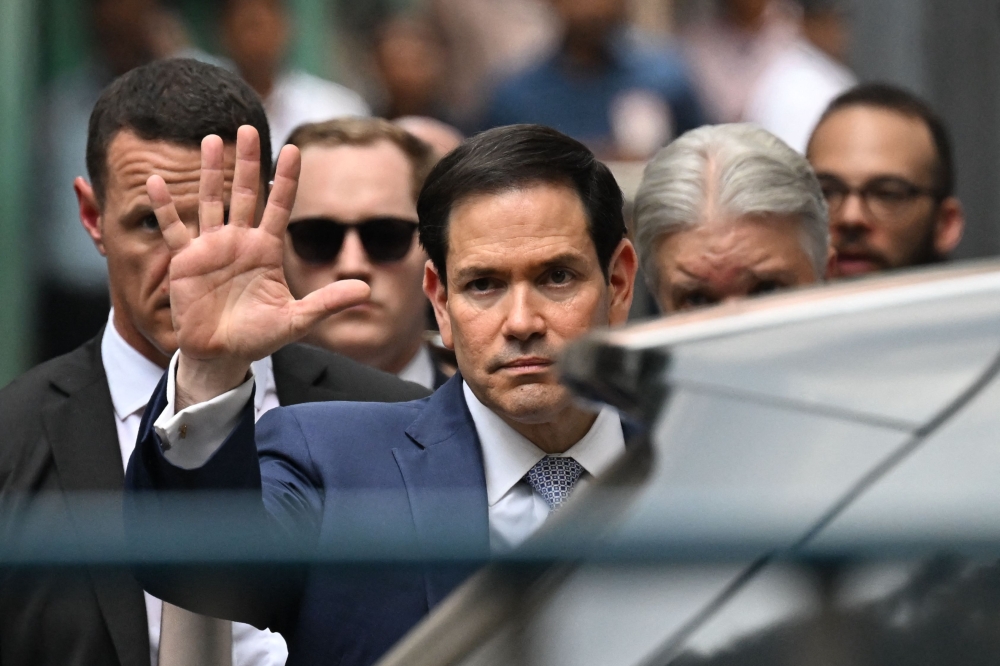 US Secretary of State Marco Rubio gestures as he walks out of the international headquarters of Missionaries of Charity known as the 