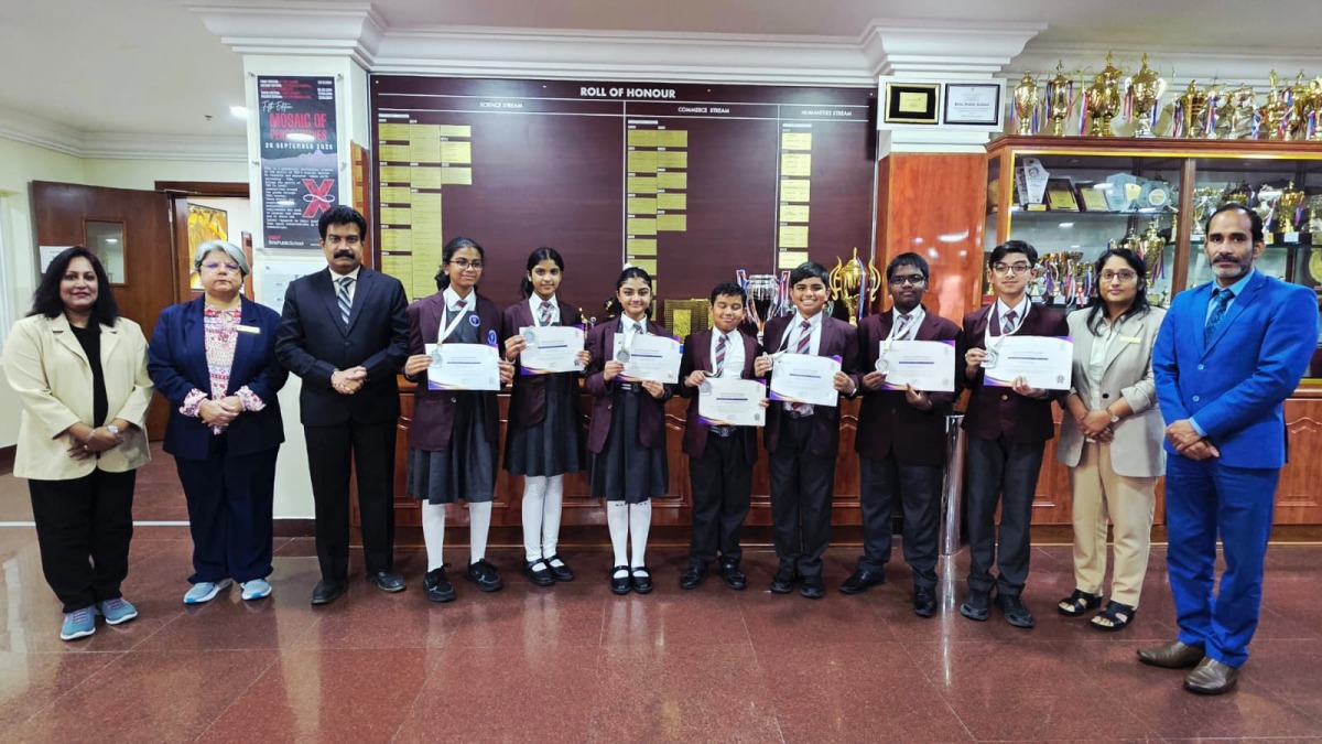 Birla Public School Principal Dr. Anand R. Nair, vice principals, and teachers with the winning students.