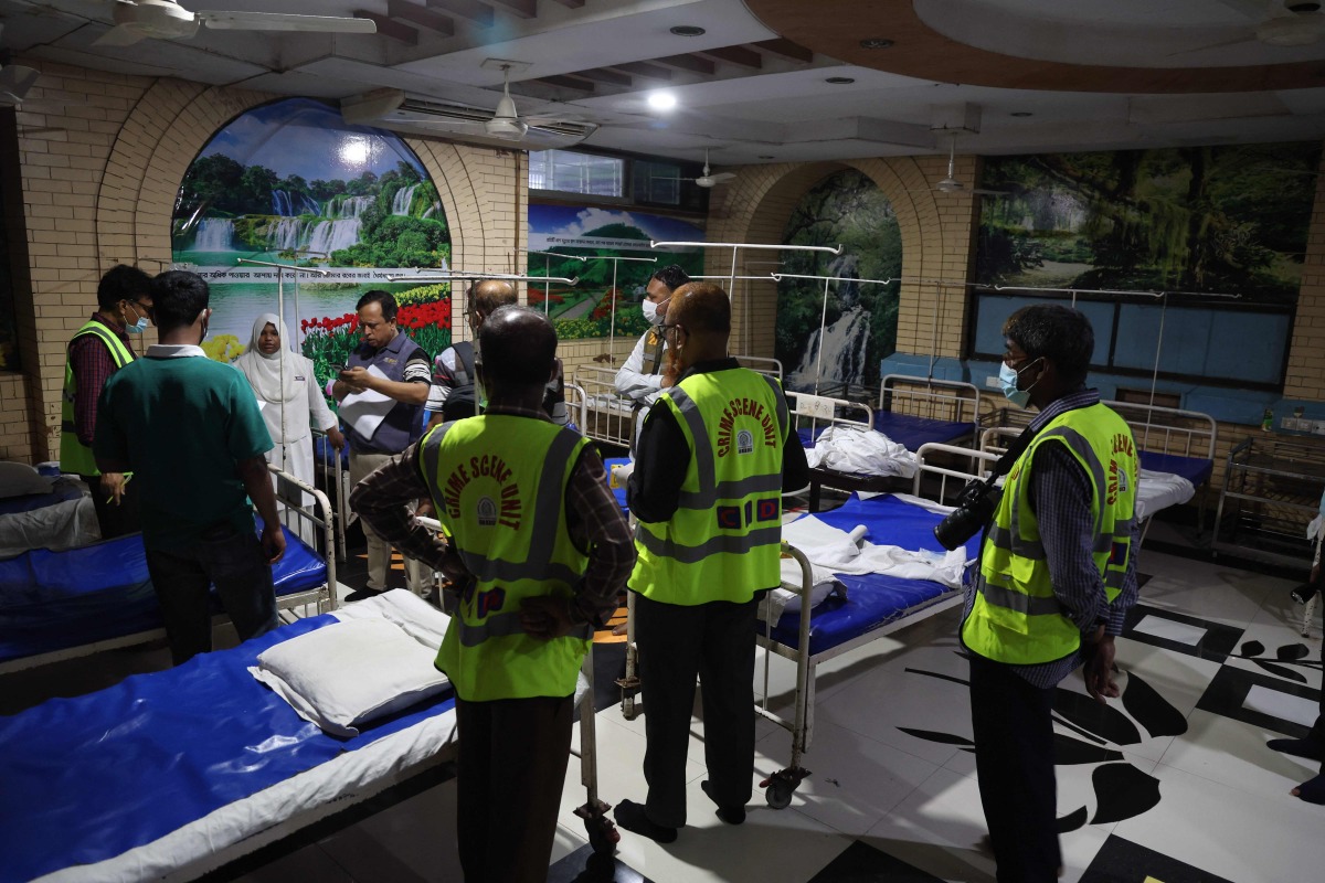 Criminal Investigation Department (CID) officials inspect inside the neonatal ward of Ad-Din hospital in Dhaka on May 27, 2026, after six newborns died in the facility earlier in the day. Photo by Abdul Goni / AFP