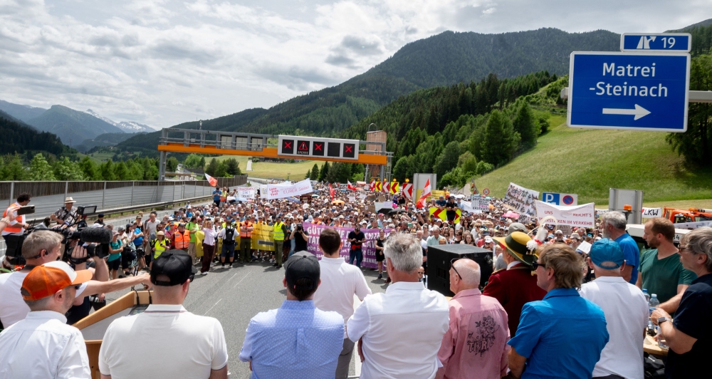 Protesters listen to speakers at the A13 Brenner Highway in the direction of Italy during a demonstration and the blockade of the Brenner Base Tunnel against transit traffic near the A13 Brenner Highway in the direction of Italy, on May 30, 2026, on the Tyrolean Brenner Highway. (Photo by Joe Klamar / AFP)