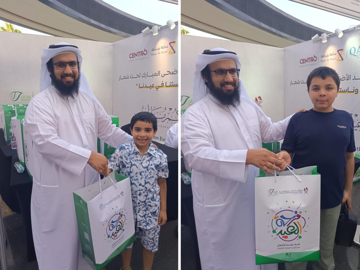 A child receives an Eid gift during the programme.  