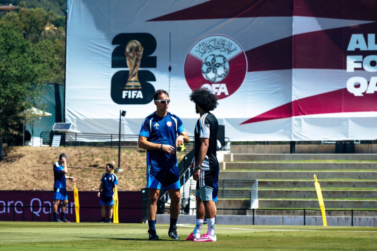 Qatar head coach Julen Lopetegui (left) with Akram Afif during a training session in Santa Barbara yesterday. 