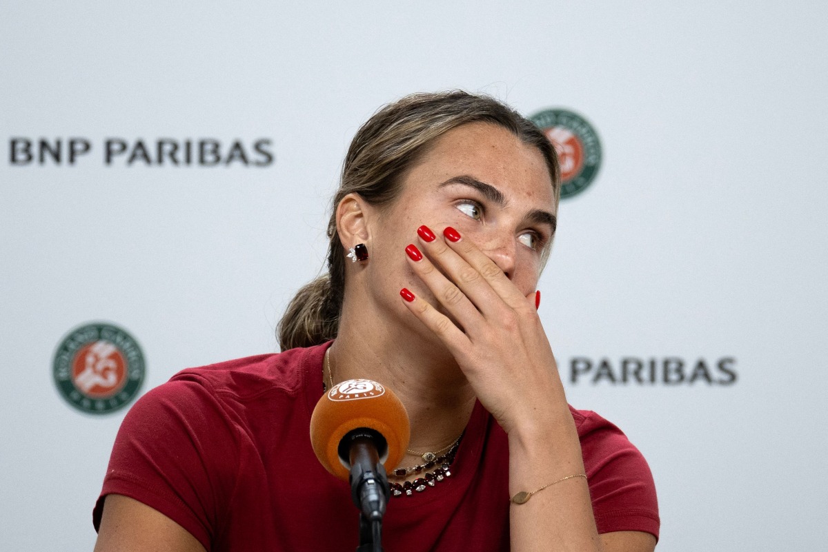 Aryna Sabalenka reacts during a press conference after being defeated by Diana Shnaider during their women's quarter final singles match on day 11 of the French Open tennis tournament on Court Philippe-Chatrier at the Roland-Garros Complex in Paris on June 3, 2026. (Photo by Sébastien DUPUY / AFP)
