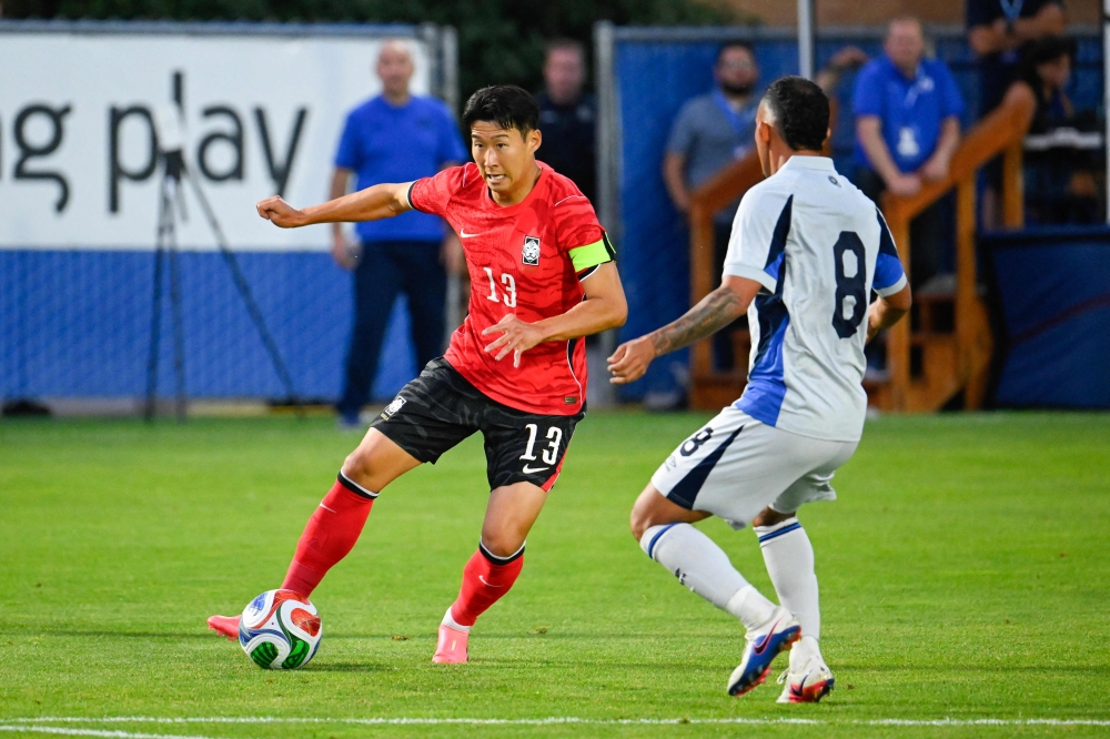 Son Heung-Min #13 of Korea Republic looks for a pass around Brayan Landaverde #8 of El Salvador during the second half of the international friendly match on June 03, 2026 in Provo, Utah. Alex Goodlett/Getty Images/AFP 