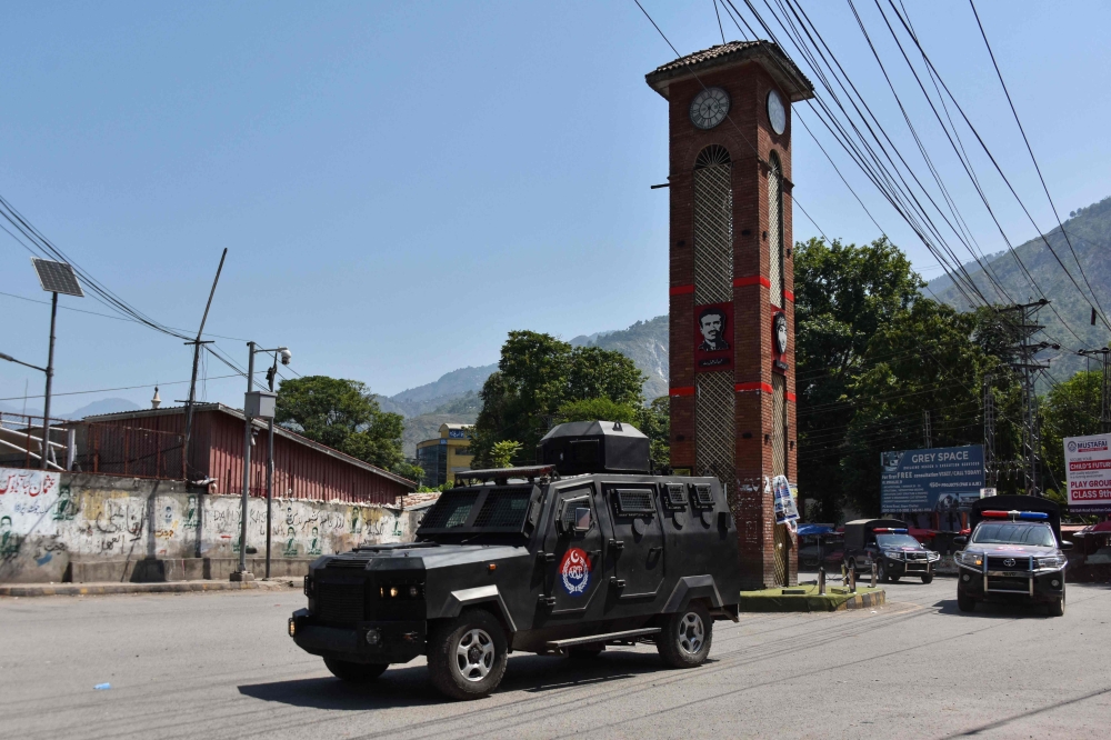Security personnel patrol a street during Joint Awami Action Committee (JAAC)'s rally, held days after the local government banned the protest group under anti-terror laws in Muzaffarabad, capital of Pakistan-administered Kashmir on June 9, 2026. (Photo by AFP)