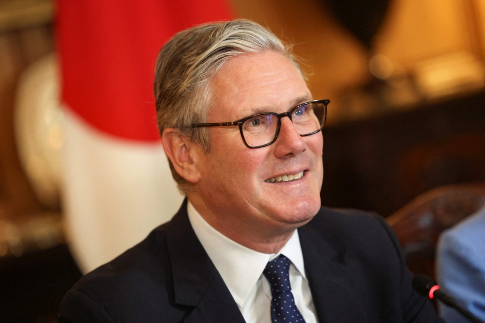 Britain's Prime Minister Keir Starmer attends a business roundtable meeting at Downing Street in central London on June 14, 2026. (Photo by Toby Shepheard / POOL / AFP)