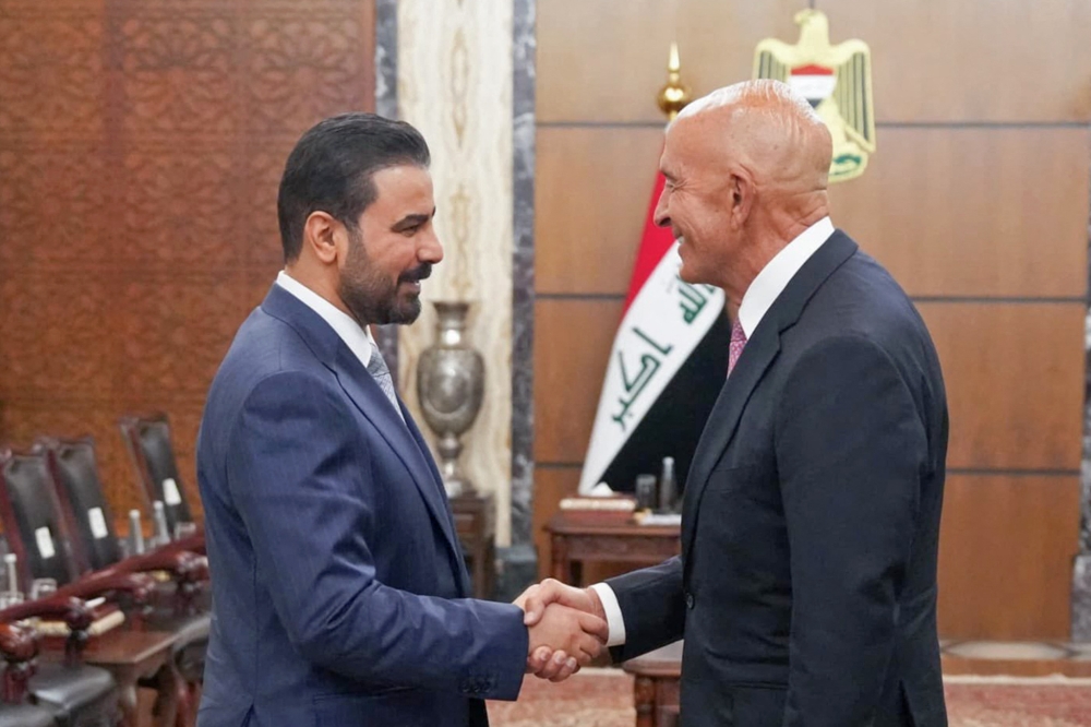 This handout picture released by Iraq's Prime Minister's Media Office shows Iraq's new Prime Minister Ali al-Zaidi (L) meeting with US Special Envoy for Syria and Ambassador to Turkiye Tom Barrack during his visit in Baghdad on June 16, 2026. (Photo by AFP) /