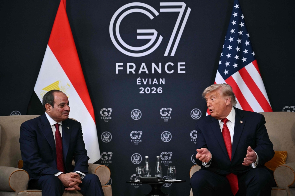 Egypt's President Abdel Fattah El-Sisi (L) and US President Donald Trump attend a bilateral meeting on the sidelines of the G7 summit, in Evian, eastern France, on June 17, 2026. (Photo by Mandel NGAN / AFP)