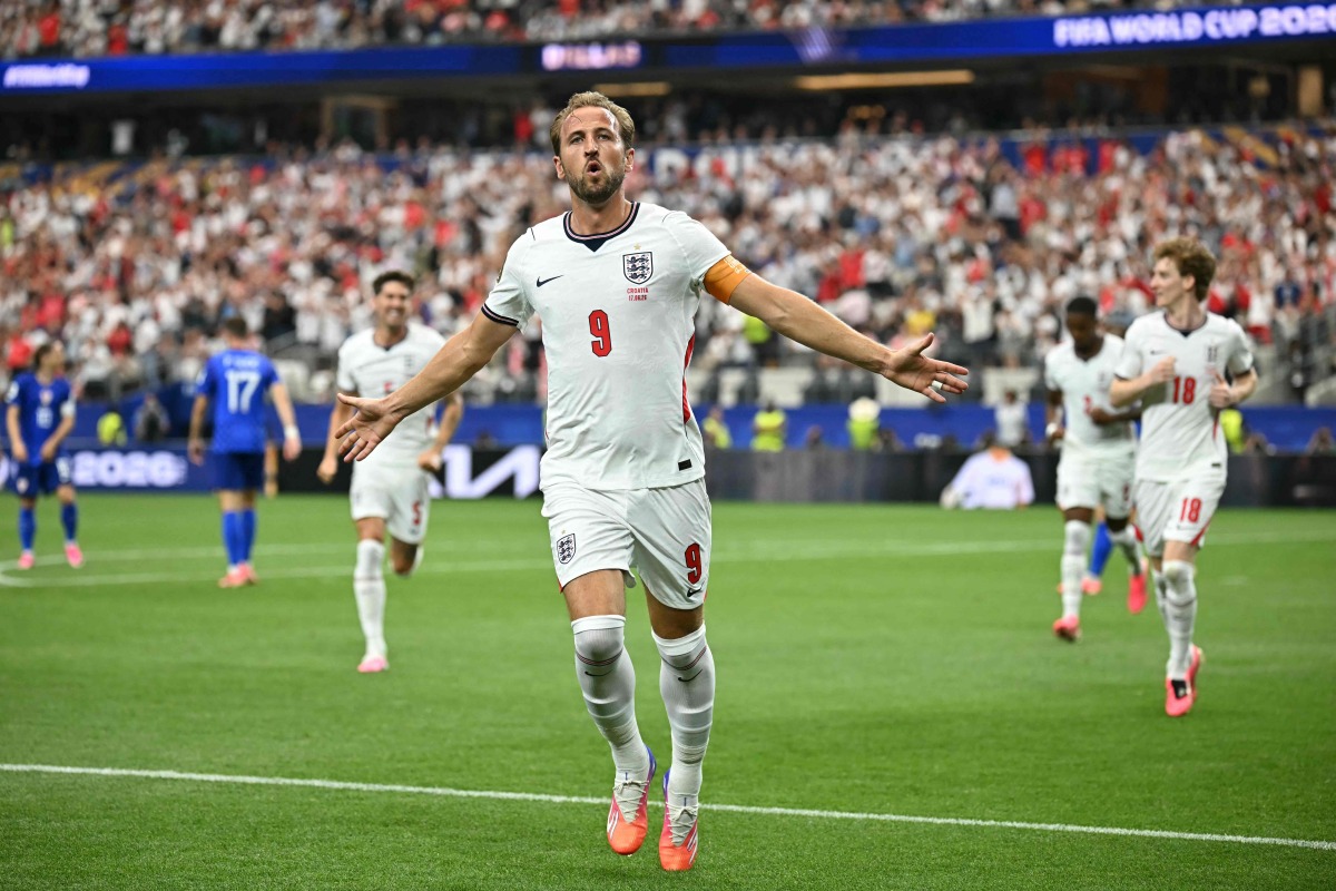 England's forward #09 Harry Kane celebrates after scoring his team's second goal during the 2026 World Cup Group L football match between England and Croatia at the Dallas Stadium in Arlington on June 17, 2026. (Photo by Paul ELLIS / AFP)