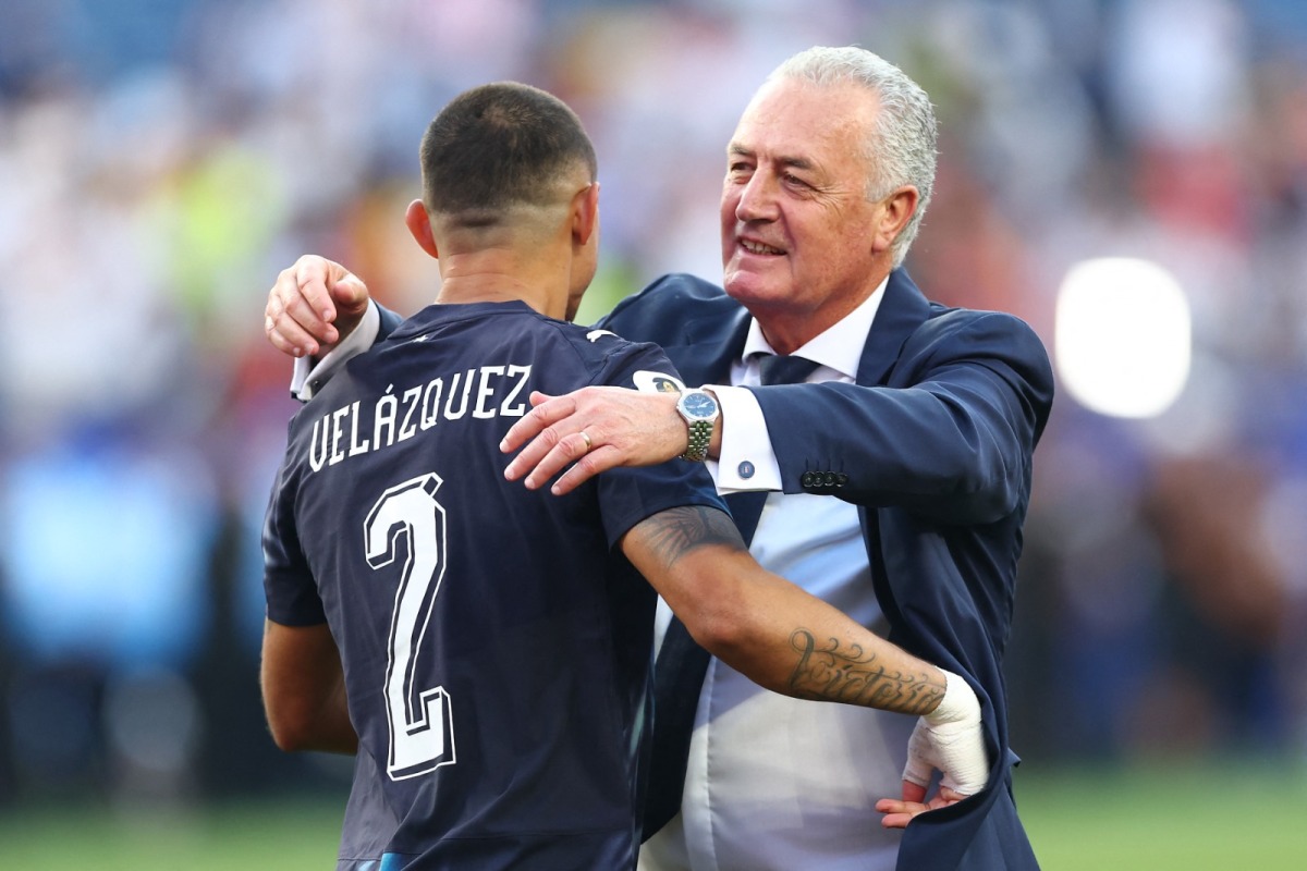 Gustavo Alfaro, Head Coach of Paraguay, embraces Gustavo Velazquez #2 after the penalty shootout win during the FIFA World Cup 2026 Round Of 32 match between Germany and Paraguay at Boston Stadium on June 29, 2026 in Foxborough, Massachusetts. (Photo by ROBERT CIANFLONE / GETTY IMAGES NORTH AMERICA / Getty Images via AFP)