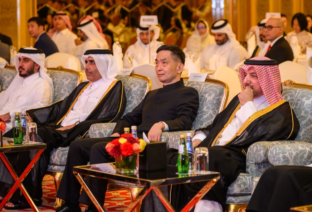 Minister of State H E Essa bin Hilal Al Kuwari (second left), Ambassador of China H E Cao Xiaolin (third left) and Director of the Department of Protocol of the Ministry of Foreign Affairs H E Ibrahim Yousif Abdullah Fakhro (right) during the event.