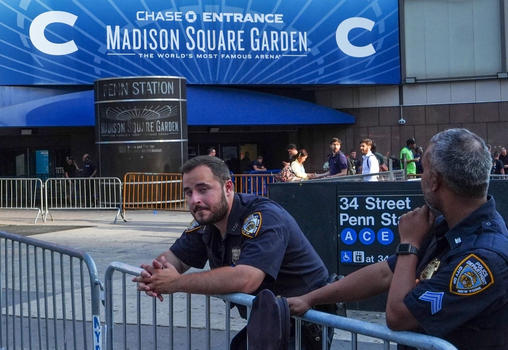 New York City police officers stand guard outside Madison Square Garden in Manhattan, New York on July 2, 2026. Photo by Ryan Murphy / AFP