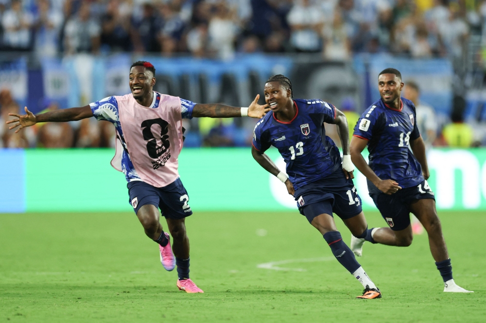 Cape Verde's defender #13 Sidney Lopes Cabral celebrates with teammates scoring his team's second goal during the 2026 World Cup round of 32 football match between Argentina and Cape Verde at the Miami Stadium in Miami Gardens on July 3, 2026. (Photo by PATRICIA DE MELO MOREIRA / AFP)