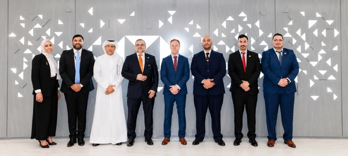 Chief Executive Officer, Qatar, HSBC Bank Middle East Limited, Abdul Hakeem Mostafawi and Chief Executive Officer, Noqoody, Nayef Rashwan pose for a group photo with other officials.