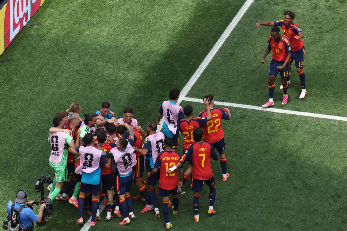 Spain's players celebrate after Mikel Merino scored their second goal against Belgium on Friday.