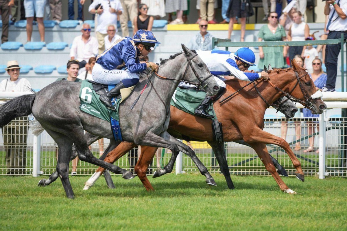 Fakhira (front) with Christophe Soumillon in the saddle competes during the 1900m race. 