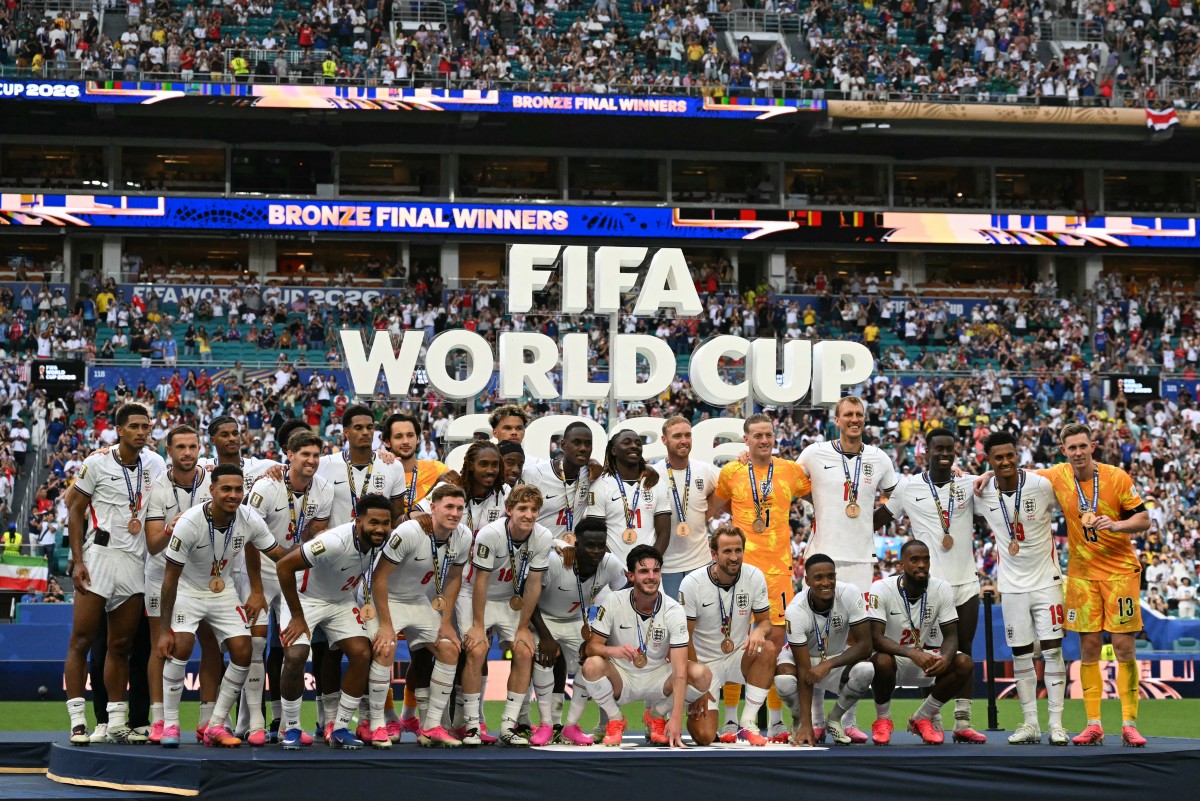 England's players pose for a photo with their medals after winning the 2026 World Cup football tournament third-place match between France and England at the Miami Stadium in Miami on July 18, 2026. (Photo by CHANDAN KHANNA / AFP)