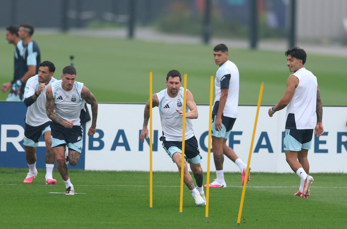 Argentina’s Lionel Messi (centre) exercises during a training session on the eve of the final. 