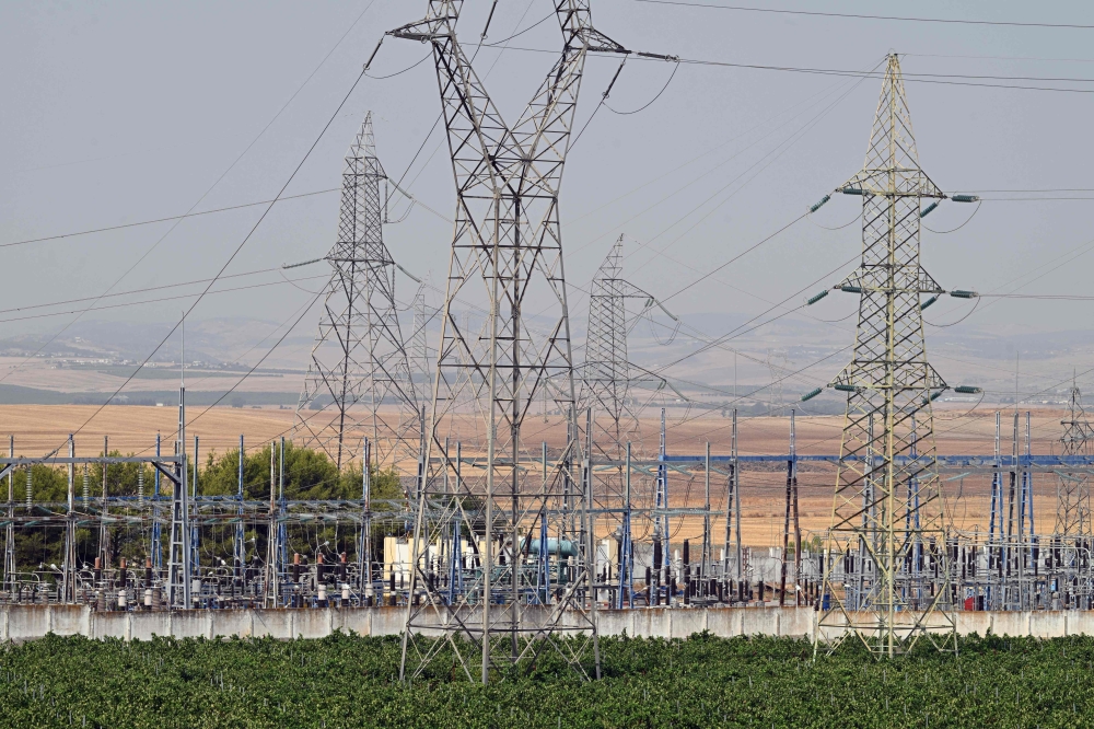This photo shows a view of a power station in Mateur on July 21, 2026. Tunisia has been experiencing a heatwave for a week, with temperatures exceeding 48 degrees celsius as people endure the ordeal of daily water and electricity cuts. (Photo by FETHI BELAID / AFP)