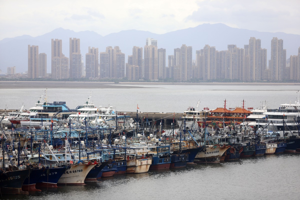 Fishing boats take shelter from the typhoon at a port in Xiamen, southeast China's Fujian Province, on July 25, 2026. (Photo by Zeng Demeng/Xinhua)