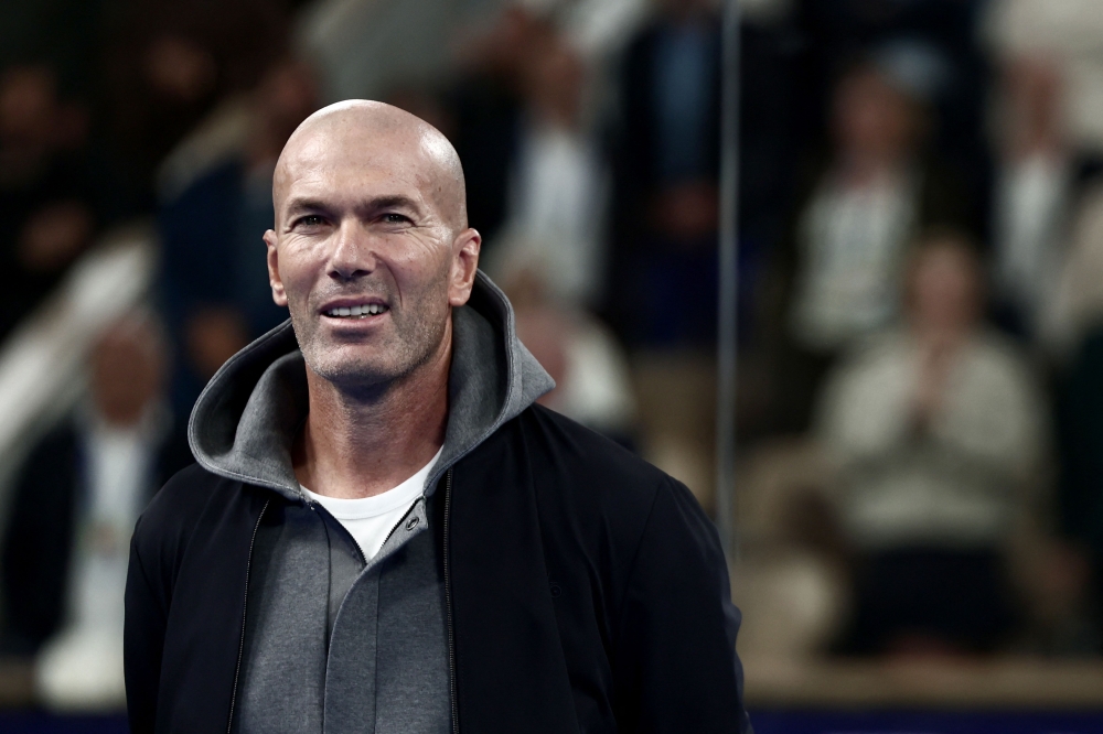 (Files) French football legend and coach Zinedine Zidane attends the podium ceremony of the women's Paris Major Premier Padel tournament after the final match on Court Philippe-Chatrier at the Roland-Garros Complex in Paris on September 14, 2025. (Photo by Thibaud Moritz / AFP)